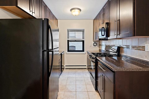 a kitchen with stainless steel appliances and a counter top